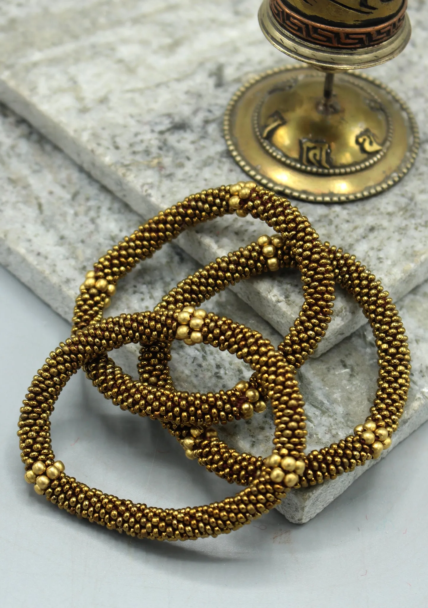 Golden Beads Nepalese Roll on Bracelet